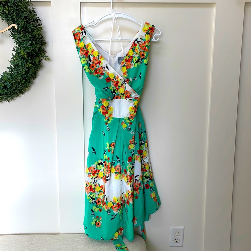 Summer polyester dress. Flowers and birds.  Has a built-in slip underneath.